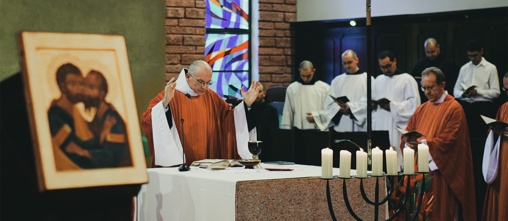 A priest during Consecration 