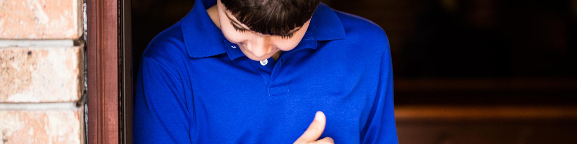 Picture of a boy in a blue shirt