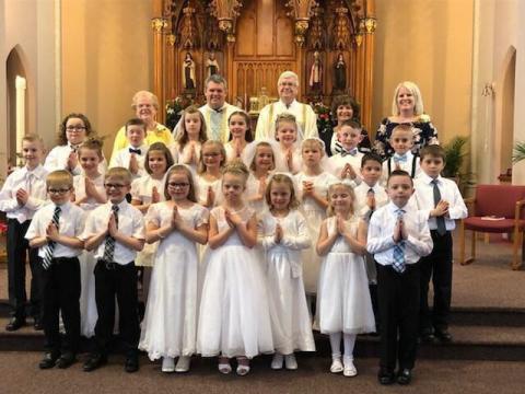 Picture of the Reffett sisters and their fellow classmates on the day of their First Communion