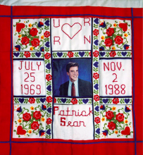 Quilt with a picture of Patrick Sean with his date of birth (July 25 1969) and the date he passed away (November 2nd 1899)