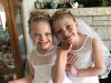 The Reffett sisters in their First Communion dresses 